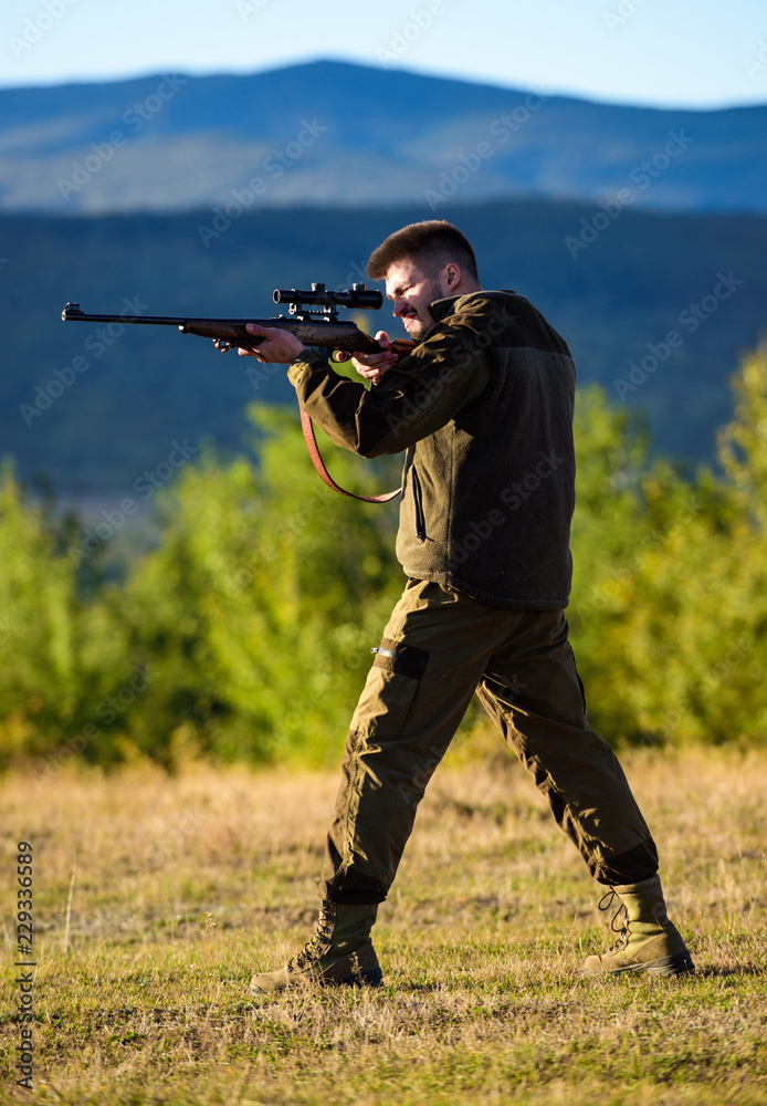 Man rifle for hunt. Hunter khaki clothes ready to hunt hold gun mountains background. Hunter with rifle looking for animal. Hunting shooting trophy. Mental preparation for hunting individual process Stock Photo | Man rifle for hunt. Hunter khaki clothes ready to hunt hold gun mountains background. Hunter with rifle looking for animal. Hunting shooting trophy. Mental preparation for hunting individual process Stock Photo |