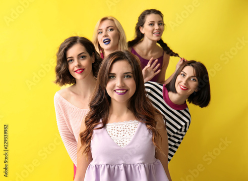 Portrait of beautiful women on color background