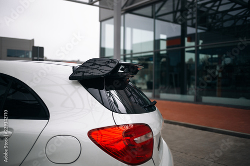 Carbon spoiler on the trunk of modern hatchback car photo