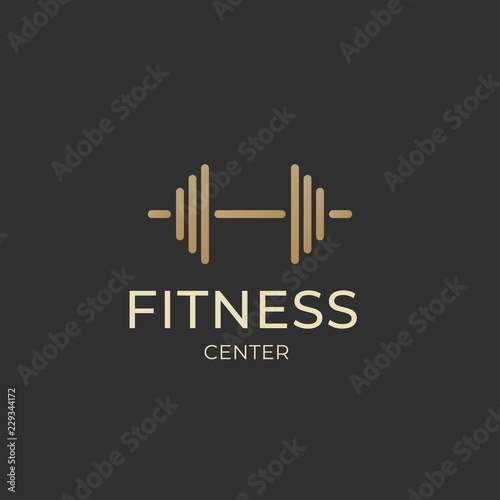 Gym logotype. Fitness center logo design template with barbell isolated on dark background. Dumbbell icon