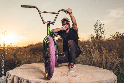 Young with bmx bike rider.Urban street sport concept