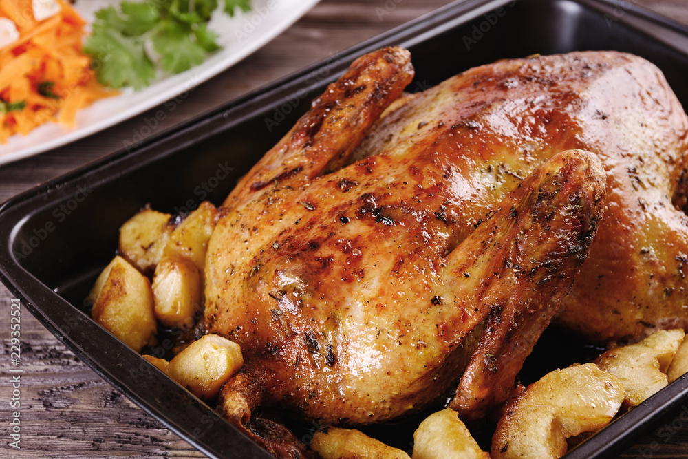 Baked duck with apples in a baking dish only cooked and ready for dinner Baked duck with apples in a baking dish only cooked and ready for dinner