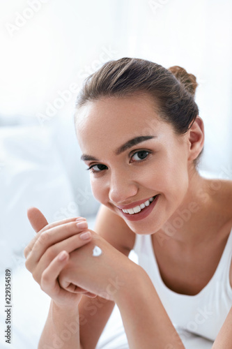 Hand Cream. Beautiful Girl Applying Cream On Hands Skin