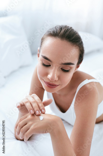 Hand Cream. Beautiful Girl Applying Cream On Hands Skin