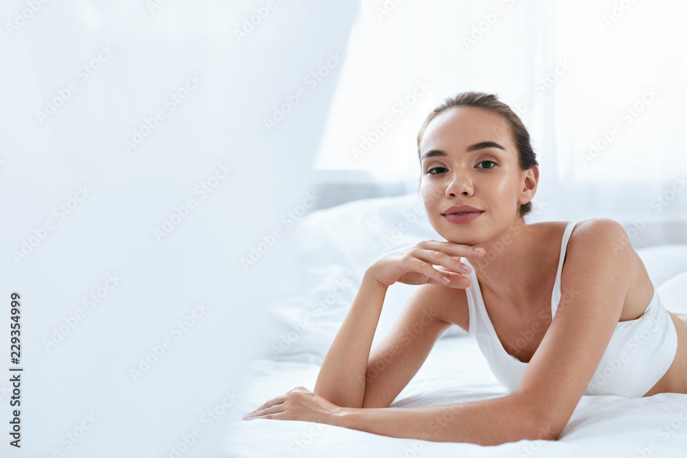 Beauty Girl With Beautiful Face And Skin Lying On White Bed Beauty Girl With Beautiful Face And Skin Lying On White Bed