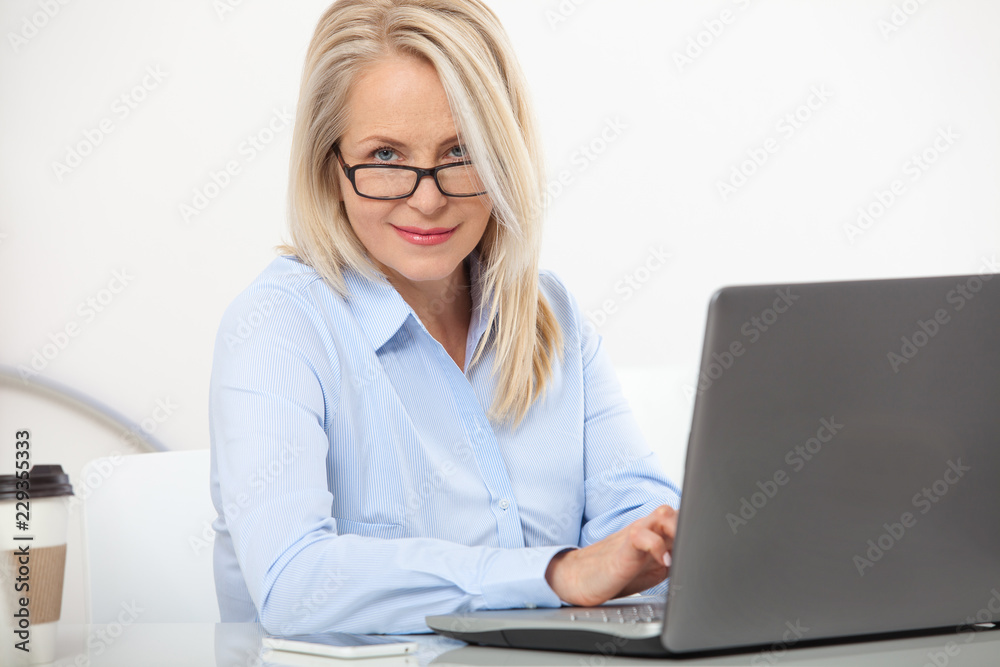 Portrait of a attractive business woman with glasses at office Portrait of a attractive business woman with glasses at office