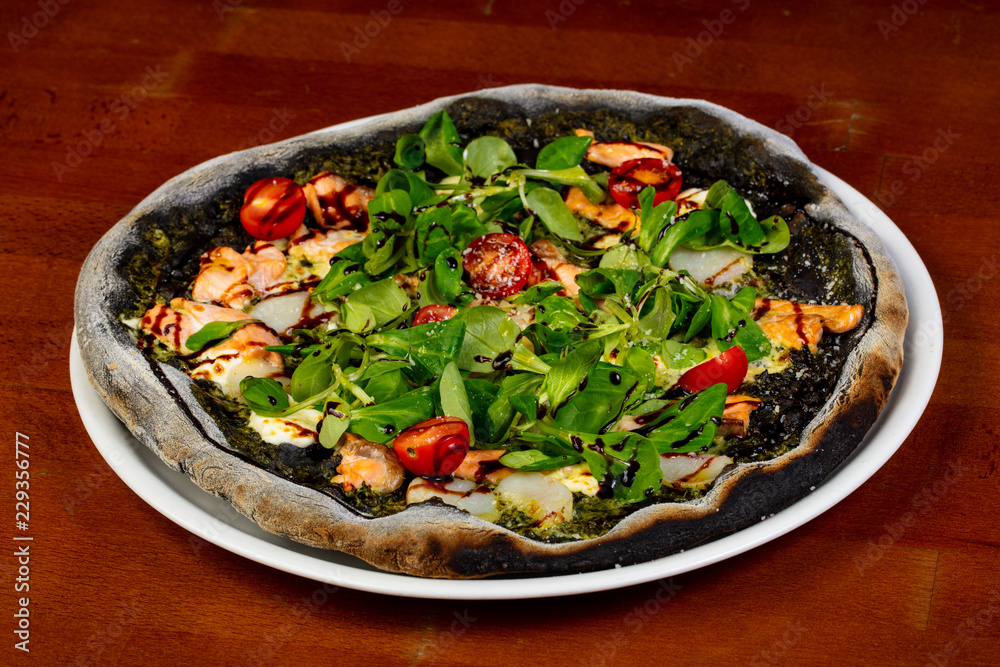 Black pizza with scallops