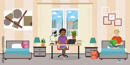 Teen room interior.African american female teen working on laptop