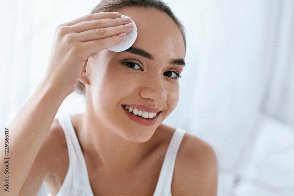 Clean Face. Beautiful Woman Cleaning Skin With Cosmetic Pad Clean Face. Beautiful Woman Cleaning Skin With Cosmetic Pad