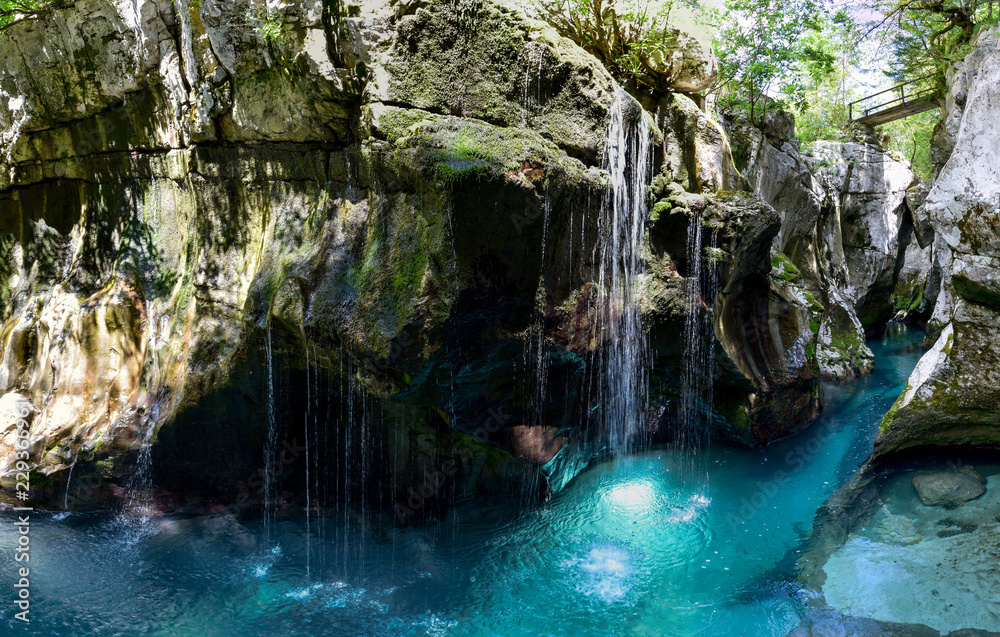 Naklejka premium Just above Lepena Valley close to Bovec the Soča (Isonzo) River has carved 750 meters long gorge named Velika Korita. The gorge is completely narrow at some points up to 15 m deep.
