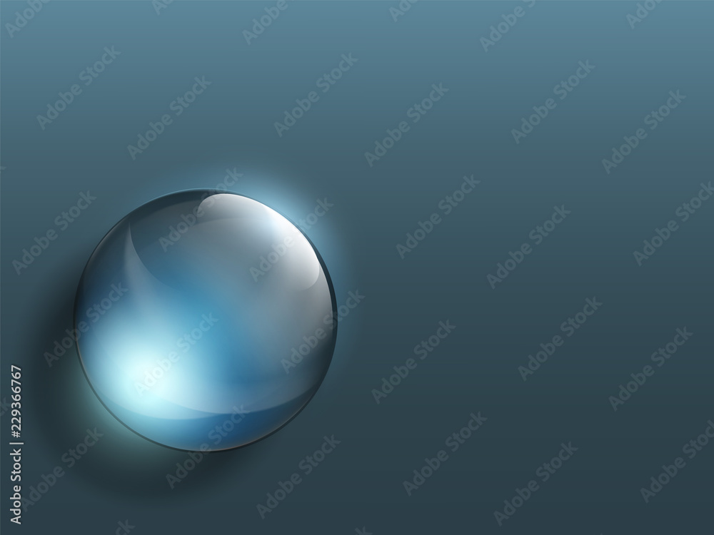Transparent crystal ball on a dark background.
