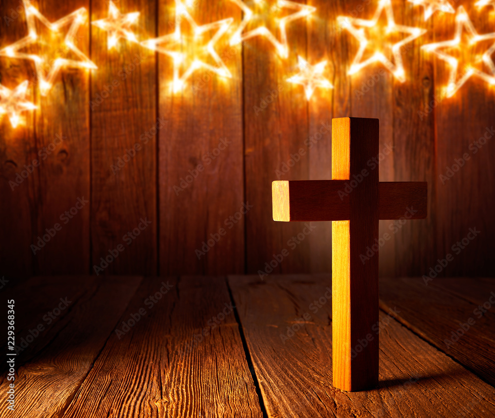 Christian wood cross on Christmas stars