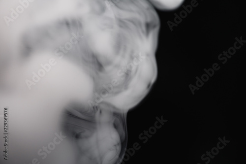 Fototapeta Naklejka Na Ścianę i Meble -  Cigarette Smoke On Black Background Detailed Close-Up