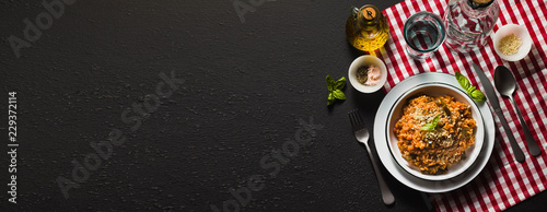 banner of Italian risotto with tomato sauce on the table. copy space