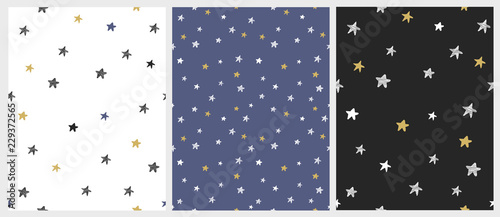 Set of 3 Varius Star Vector Patterns. Irregular Hand Drawn Simple Starry Sky Print. Christmas Night Illustrations. Infantile Style Design. White, Gray, Gold and Blue Stars on a White, Blue and Black..