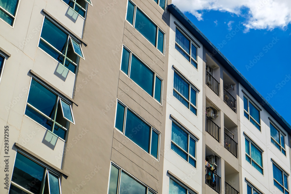 Modern condominium building real etate in city with blue sky Modern condominium building real etate in city with blue sky