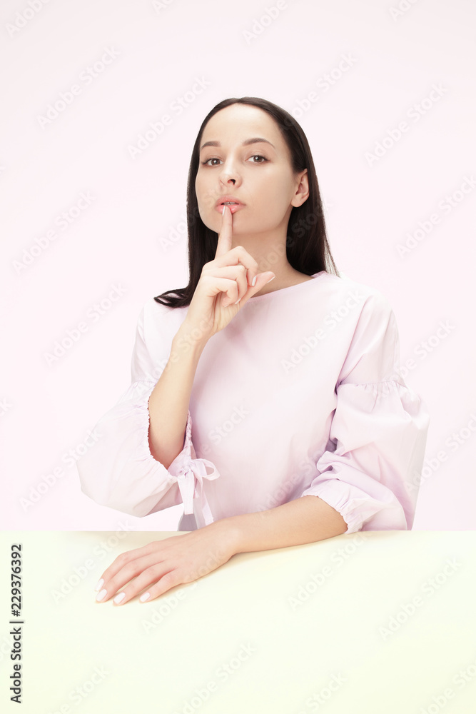 Shhhhh . Beautiful girl with bright makeup and curly hair telling a secret .Portrait happy woman who is calling to someone .Funny girl model whispering about something. Expressive facial expressions Shhhhh . Beautiful girl with bright makeup and curly hair telling a secret .Portrait happy woman who is calling to someone .Funny girl model whispering about something. Expressive facial expressions