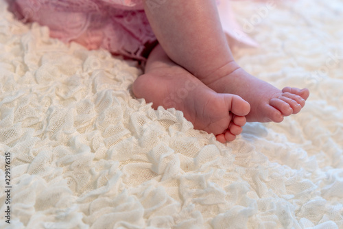 baby feet on white blanket