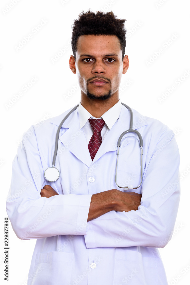 Studio shot of young African man doctor with arms crossed Studio shot of young African man doctor with arms crossed