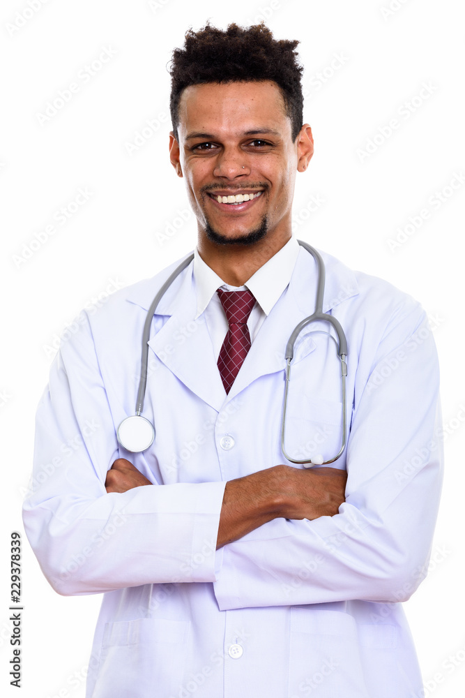 Young happy African man doctor smiling with arms crossed Young happy African man doctor smiling with arms crossed