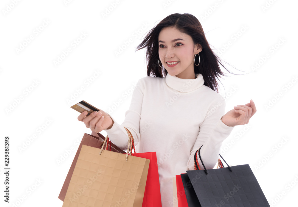 happy woman holding credit card and shopping bag isolated on white background happy woman holding credit card and shopping bag isolated on white background