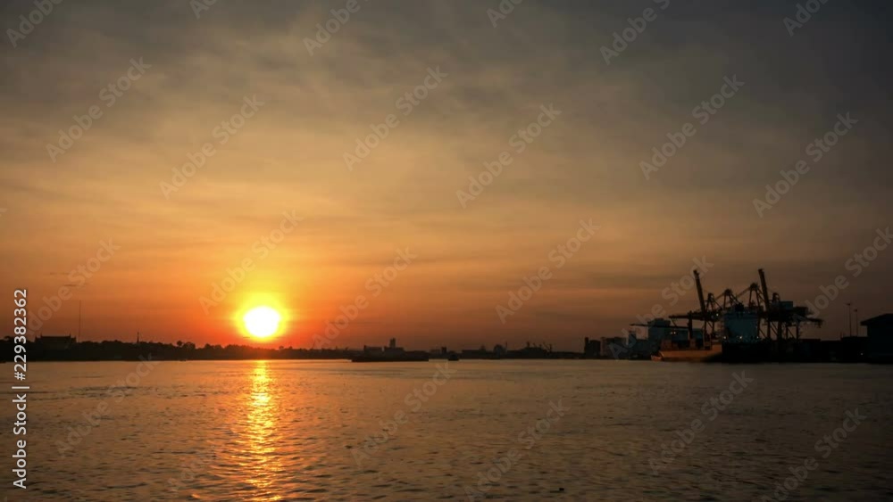 time lapse, sunrise at the pier at the Chao Phraya River, Bangkok, Thailand time lapse, sunrise at the pier at the Chao Phraya River, Bangkok, Thailand