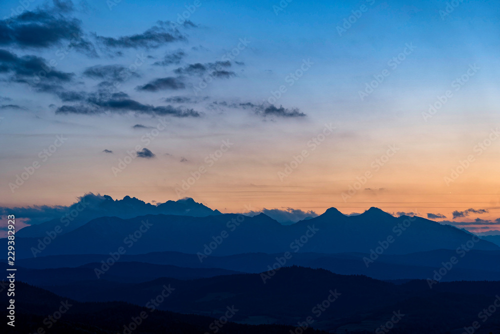 Scenic view of beautiful High Tatras mountains. Blue hour sunset with pink and blue tones, Slovakia.