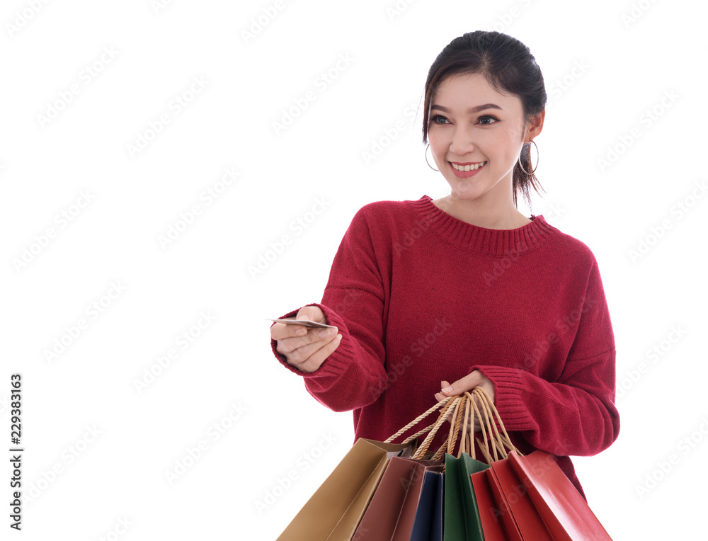 happy woman holding credit card and shopping bag isolated on white background happy woman holding credit card and shopping bag isolated on white background
