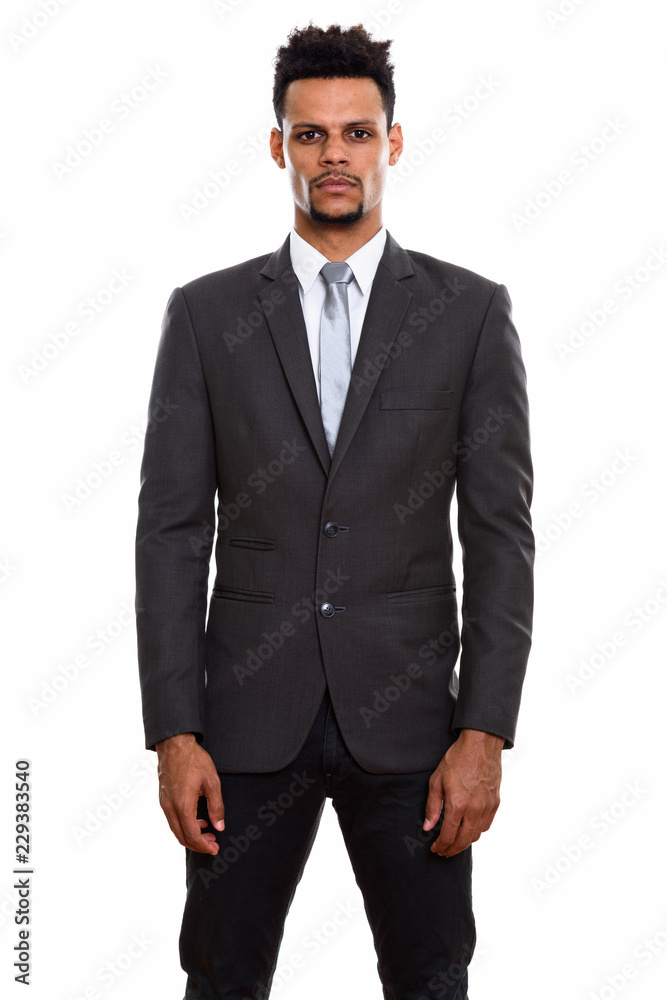 Studio shot of young African businessman standing Studio shot of young African businessman standing