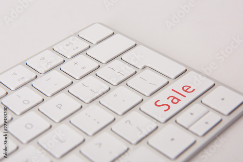 close-up shot of computer keyboard with black friday button isolated on white