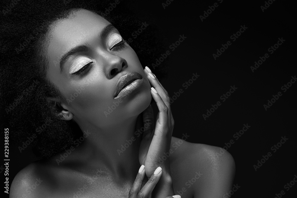 black and white photo of attractive african american woman isolated on black black and white photo of attractive african american woman isolated on black