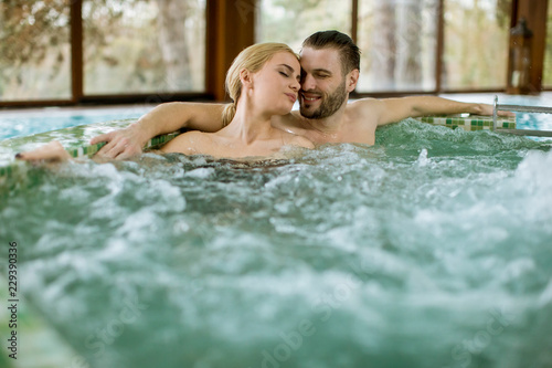 Loving couple relaxing in hot tub
