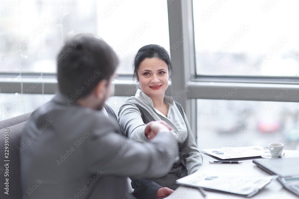 close up. handshake trading partners at the desktop close up. handshake trading partners at the desktop