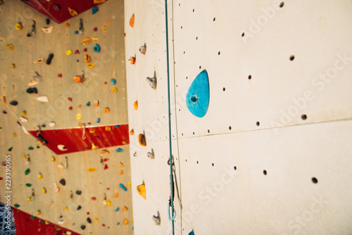 Climbing wall with colorful footholds