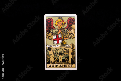 An individual major arcana tarot card isolated on black background. Judgement.