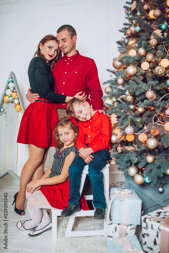 Young family being playful at home. Christmas time for young family little son and daughter. Winter holidays moment