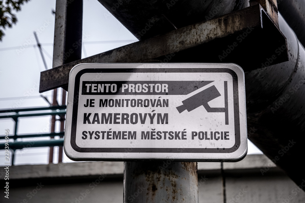 Surveillance sign written in Czech language warning about monitoring