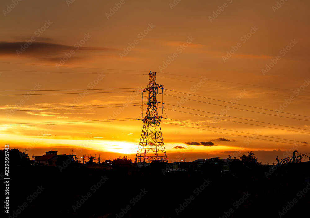 Fototapeta premium High voltage pylons on the evening sunset, silhouette