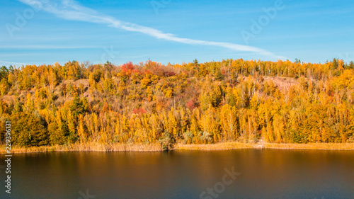 A beautiful landscape with an autumn forest and a river in a mountainous area