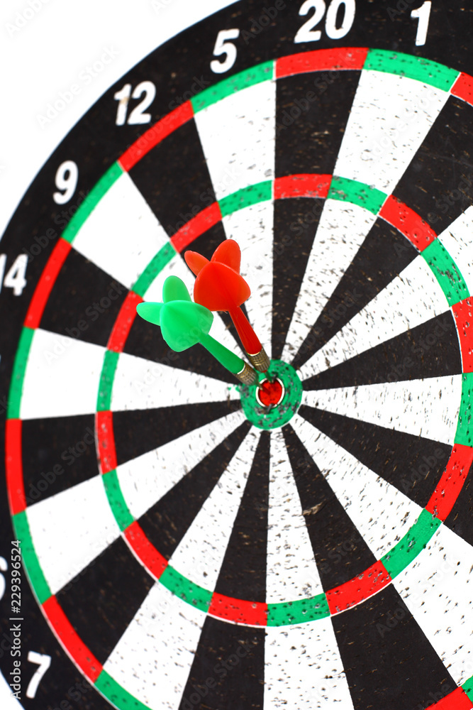 closeup. several Arrows dart hitting the center of the target d closeup. several Arrows dart hitting the center of the target d