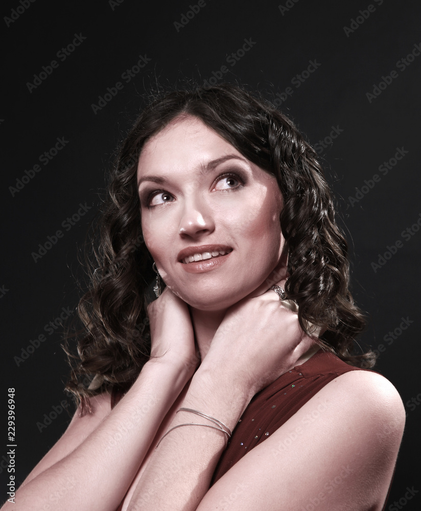 portrait of beautiful woman in red dress posing for the camera portrait of beautiful woman in red dress posing for the camera