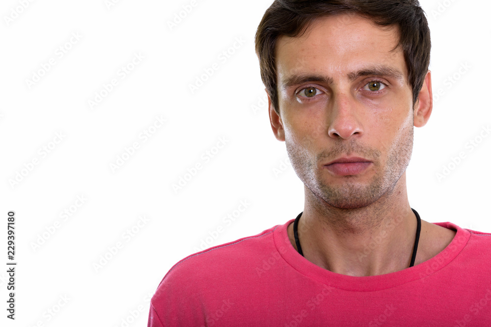 Close up of young handsome man face looking at camera Close up of young handsome man face looking at camera