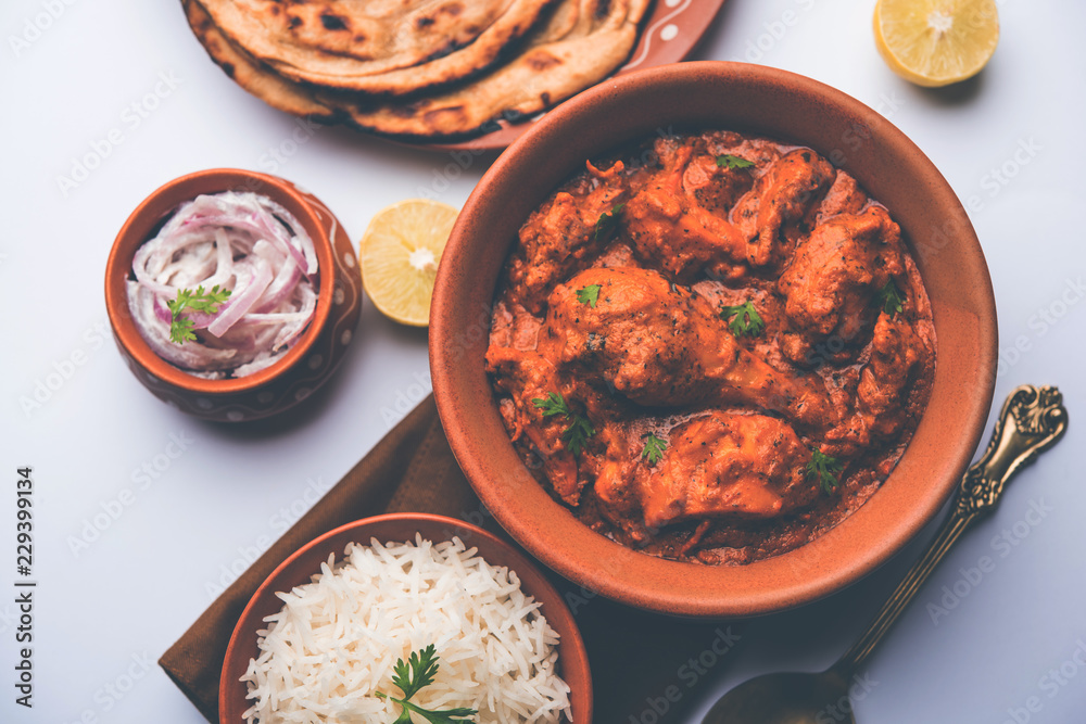 Murgh Makhani / Butter chicken tikka masala served with roti / Paratha and plain rice along with