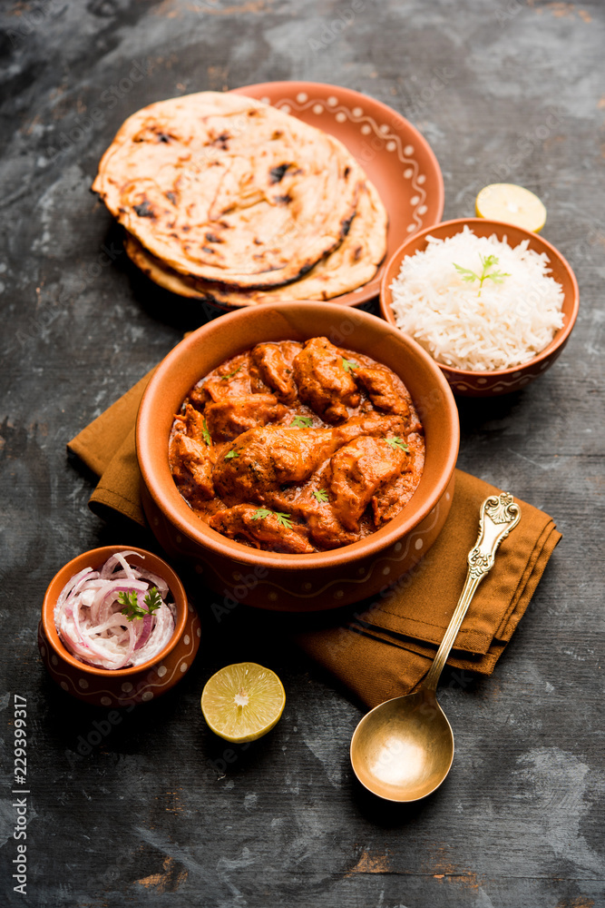 Murgh Makhani / Butter chicken tikka masala served with roti / Paratha and plain rice along with