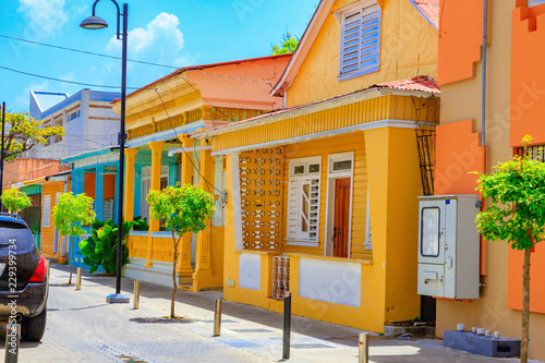 Typical yellow house in Puerto Plata, Dominican Republic. Beautiful and contemplative. photo
