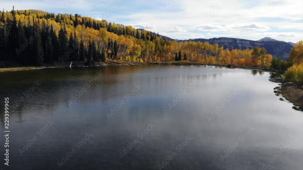 Autumn leaves over beautiful mountain lake Autumn leaves over beautiful mountain lake