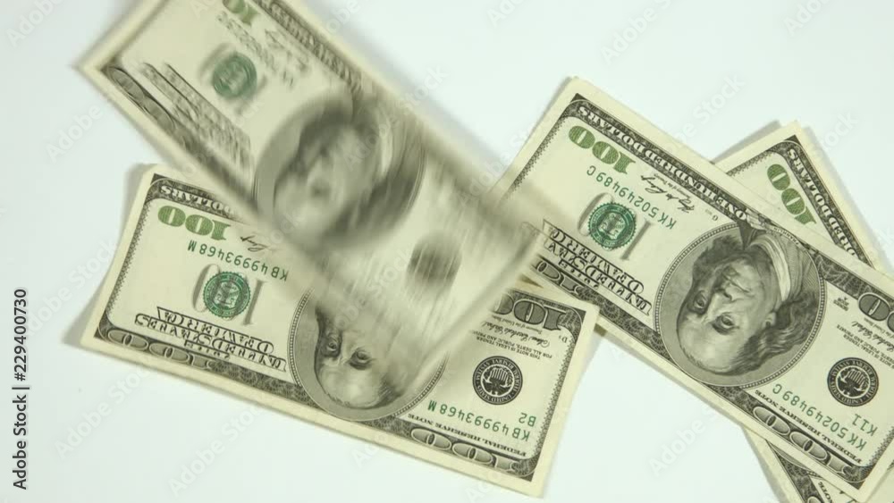 Dollars falling on a white background