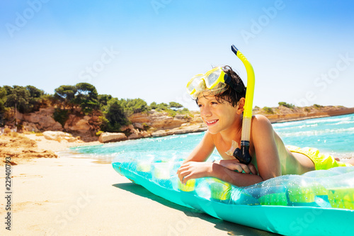 Young diver spending summer vacation on the beach