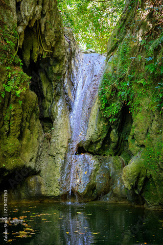 Secret waterfall in the middle of the jungle and mountains of Puerto Plata, Dominican Republic.