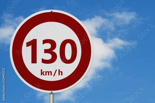 Red and white 130 km speed limit sign